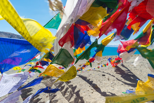 Prayer flags at Pangong Lake.Blur on foregroud.