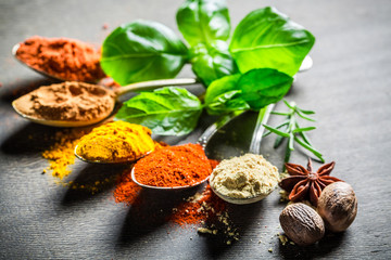 Intensive spices and herbs on old table
