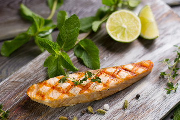 Salmon steak grilled with lime.