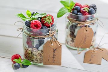 Tasty muesli with berry fruits and yogurt