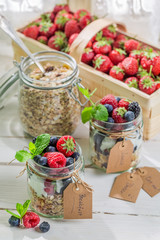 Fresh granola with yogurt and fruits