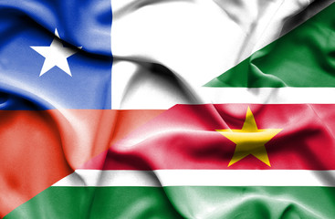 Waving flag of Suriname and Chile