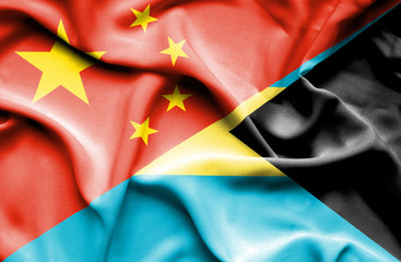 Waving flag of Bahamas and China