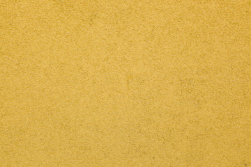 Fototapeta na wymiar Hauswand - gelbe Wand aus Putz