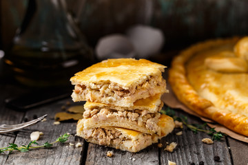 Homemade pie stuffed with chicken ang eggs
