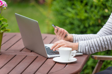 Woman with notebook on the garden