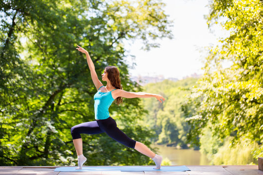 Woman Doing Yoga Outdoors.