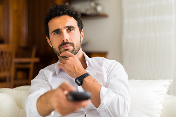 Man choosing the right TV program