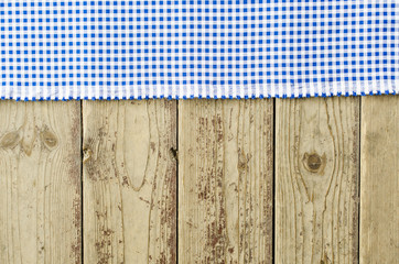 Blue tablecloth over wooden table