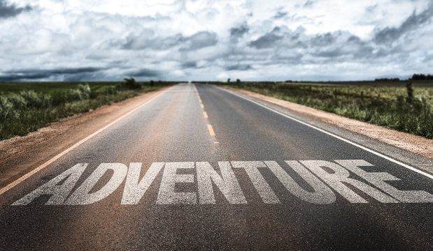 Adventure written on rural road