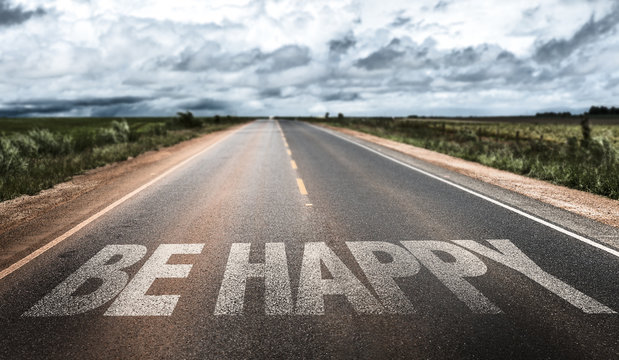 Be Happy written on rural road