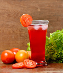 Fresh vegetable juices on wooden table