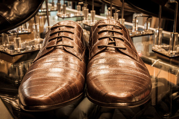 Set of black and brown mens luxury shoes in the store