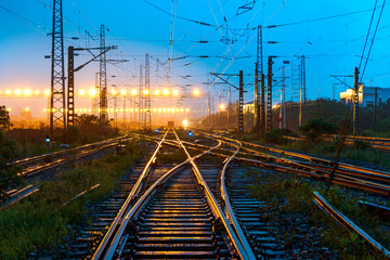 Cargo train platform at sunset with container