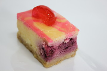  piece of cherry cake on white isolated background.