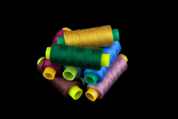 Coloured thread isolated on black background