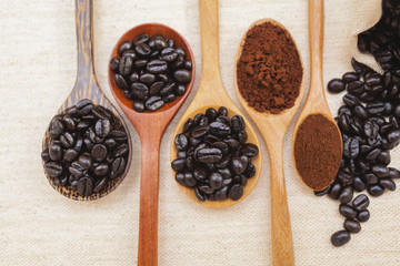 Closeup coffee beans in wooden spoon 