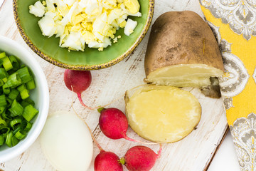 Chopped egg and vegetables - ingredients for cold beet root soup.