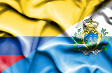 Waving flag of San Marino and Columbia