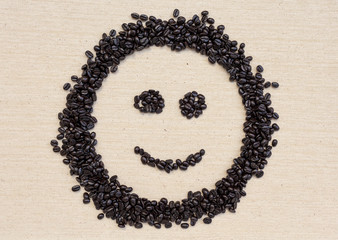 Coffee beans smile on canvas background