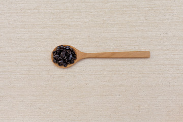 Coffee beens in wooden spoon 