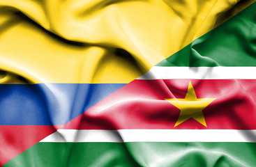Waving flag of Suriname and Columbia