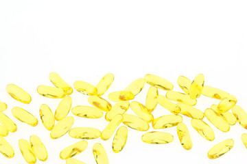 Fish oil capsules on white background.