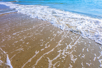 Wave of the sea on the sand beach