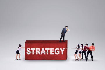 Fototapeta premium Team of workers collaborate with a strategy