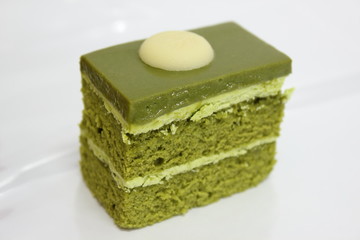  Green tea layer cake on the table.