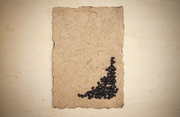 Coffee beans on natural texture brown paper