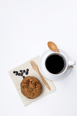Coffee raisin muffin with coffee with space on background
