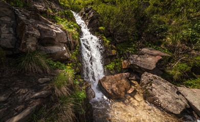 Fototapeta na wymiar Beautiful small waterfall In Mountains, Ukraine.
