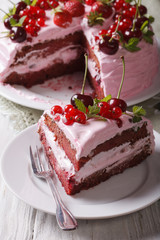 Slice of homemade berry cake with pink cream vertical
