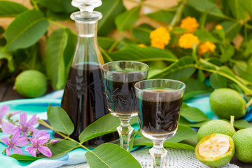 Liqueur from young green walnuts, remedy for stomach ache 