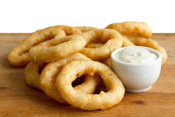 Heap of deep fried onion or calamari rings with garlic mayonnais