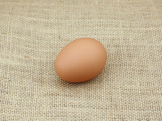 a hen egg on hemp sackcloth