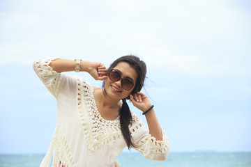 Stock Photo - Happy woman standing in sea