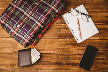 Pen on notepad next to cup of coffee passport and keyboard