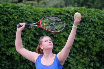 The image of girl plays tennis