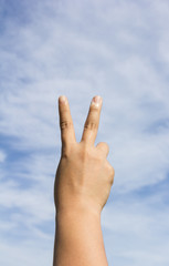 Hand making victory sign