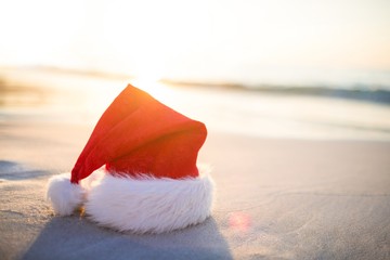 Santa hat on the beach  - Powered by Adobe