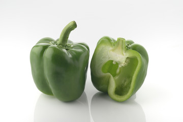 Green Bel Pepper With Cross Section On white Background