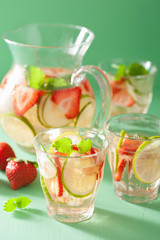 refreshing summer drink with strawberry cucumber lime in jar and