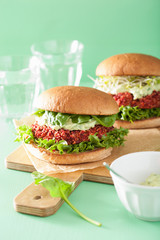 vegan beet and quinoa burger with avocado dressing