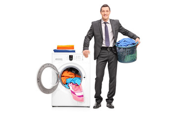 Young businessman holding a laundry basket