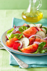 healthy tomato salad with onion cucumber pepper