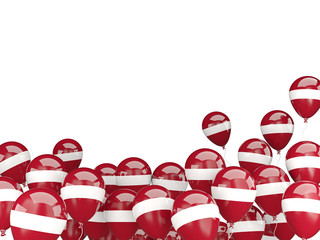 Flying balloons with flag of latvia