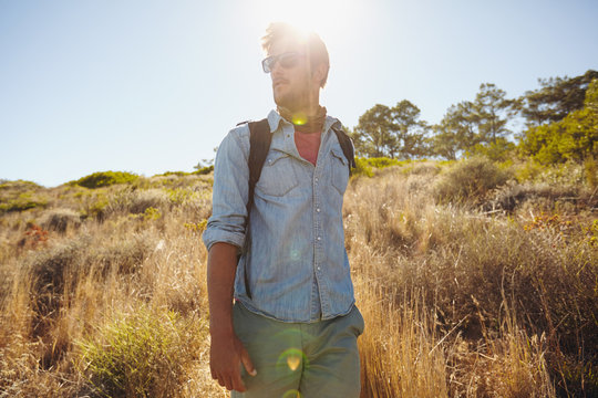 Man hiking in nature on a sunny day