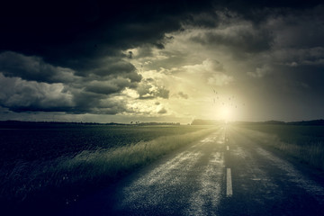 Asphalt road and dark storm clouds over it  - 86038510